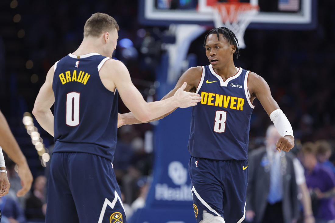 Mar 10, 2025; Oklahoma City, Oklahoma, USA; Denver Nuggets forward Peyton Watson (8) and guard Christian Braun (0) high five after scoring against the Oklahoma City Thunder during the second half at Paycom Center. Mandatory Credit: Alonzo Adams-Imagn Images