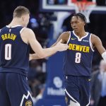 Mar 10, 2025; Oklahoma City, Oklahoma, USA; Denver Nuggets forward Peyton Watson (8) and guard Christian Braun (0) high five after scoring against the Oklahoma City Thunder during the second half at Paycom Center. Mandatory Credit: Alonzo Adams-Imagn Images