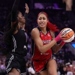 Aug 30, 2025; San Francisco, California, USA; Washington Mystics center Shakira Austin (0) drives in against Golden State Valkyries center Temi Fagbenle (14) during the second quarter at Chase Center. Mandatory Credit: Kelley L Cox-Imagn Images