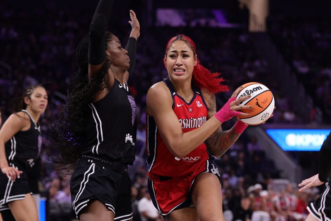 Aug 30, 2025; San Francisco, California, USA; Washington Mystics center Shakira Austin (0) drives in against Golden State Valkyries center Temi Fagbenle (14) during the second quarter at Chase Center. Mandatory Credit: Kelley L Cox-Imagn Images