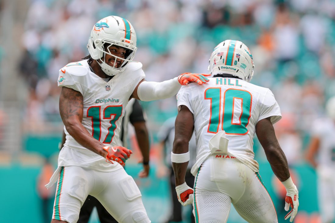 Sep 14, 2025; Miami Gardens, Florida, USA; Miami Dolphins wide receiver Tyreek Hill (10) celebrates with wide receiver Jaylen Waddle (17) after catching the football against the New England Patriots during the third quarter at Hard Rock Stadium. Mandatory Credit: Sam Navarro-Imagn Images