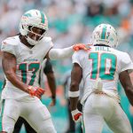 Sep 14, 2025; Miami Gardens, Florida, USA; Miami Dolphins wide receiver Tyreek Hill (10) celebrates with wide receiver Jaylen Waddle (17) after catching the football against the New England Patriots during the third quarter at Hard Rock Stadium. Mandatory Credit: Sam Navarro-Imagn Images