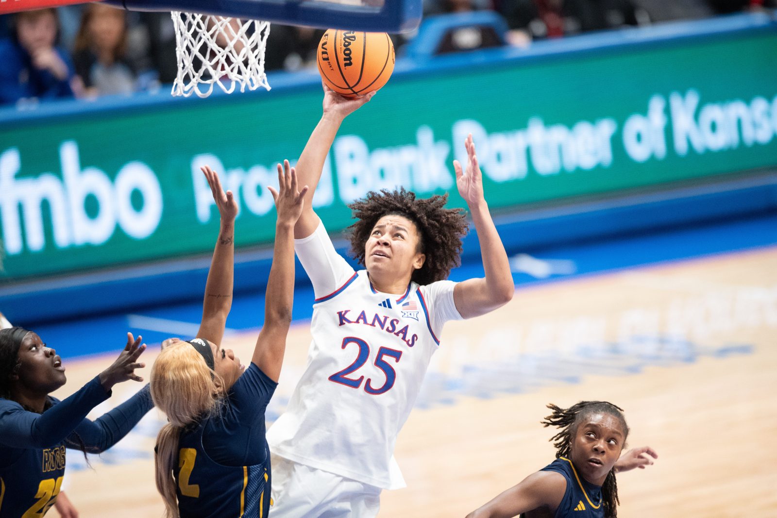 Kansas freshman forward Jaliya Davis (25) shoots under the basket during the game against UMKC inside Allen Fieldhouse on Nov. 5, 2025.