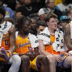 Nov 15, 2025; Charlotte, North Carolina, USA; Charlotte Hornets forward Miles Bridges (0), guard Sion James (4), guard Kon Knueppel (7) and guard Tre Mann (23) at the end of the game on the bench showing fatigue during the second half against the Oklahoma City Thunder at Spectrum Center. Mandatory Credit: Jim Dedmon-Imagn Images