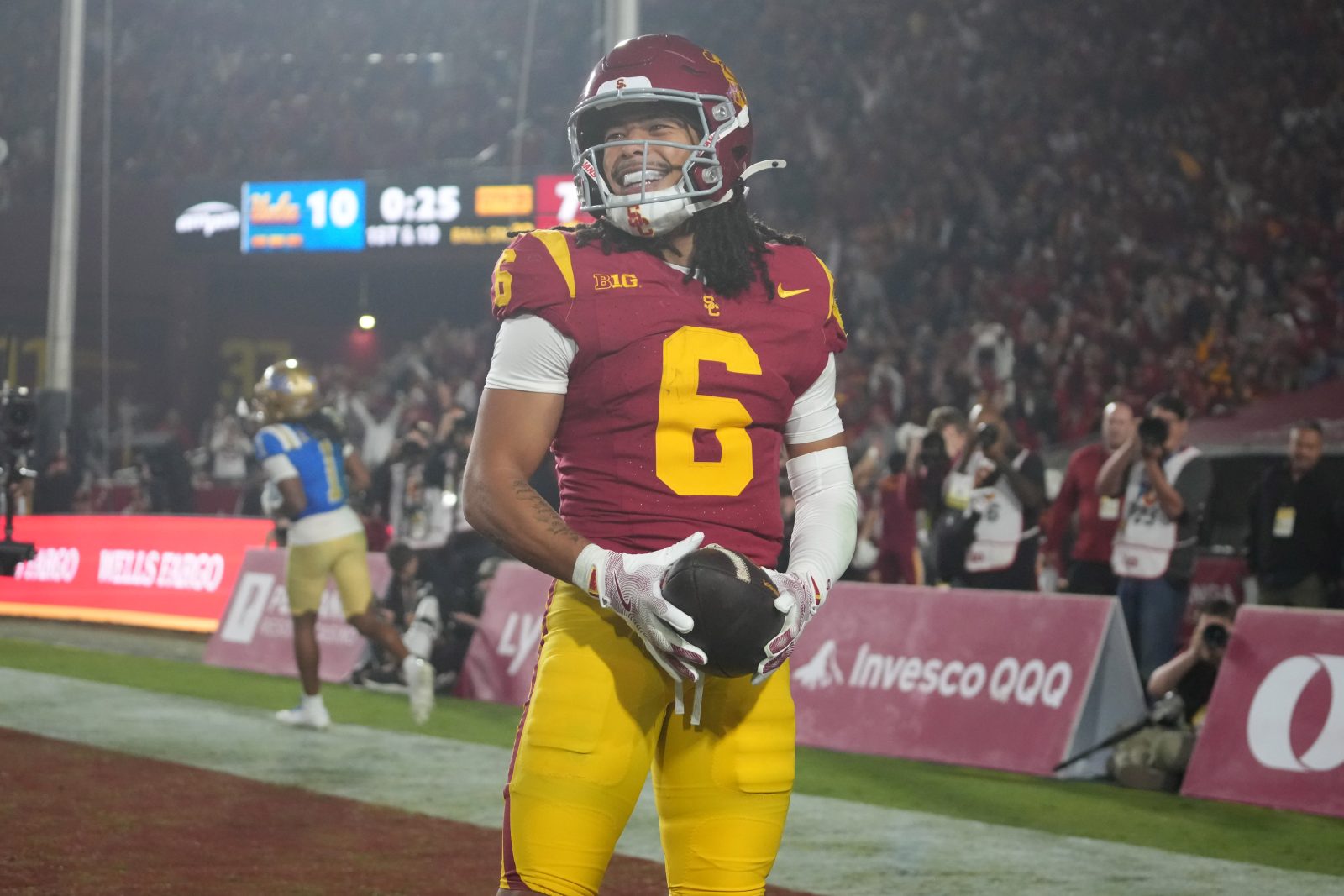 Nov 29, 2025; Los Angeles, California, USA; Southern California Trojans wide receiver Makai Lemon (6) celebrates after catching a 32-yard touchdown pass against the UCLA Bruins in the second half at United Airlines Field at Los Angeles Memorial Coliseum. Mandatory Credit: