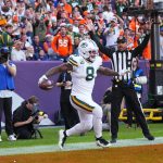 Dec 14, 2025; Denver, Colorado, USA; Green Bay Packers running back Josh Jacobs (8) reacts after a touchdown during the second quarter against the Denver Broncos at Empower Field at Mile High. Mandatory Credit: Ron Chenoy-Imagn Images