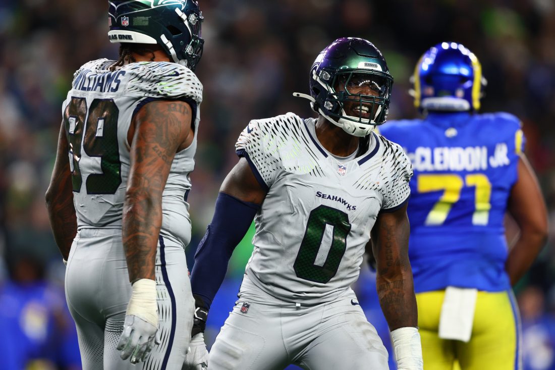 Dec 18, 2025; Seattle, Washington, USA; Seattle Seahawks defensive end Demarcus Lawrence (0) celebrates a sack against the Los Angeles Rams in the second half at Lumen Field. Mandatory Credit: Kevin Ng-Imagn Images