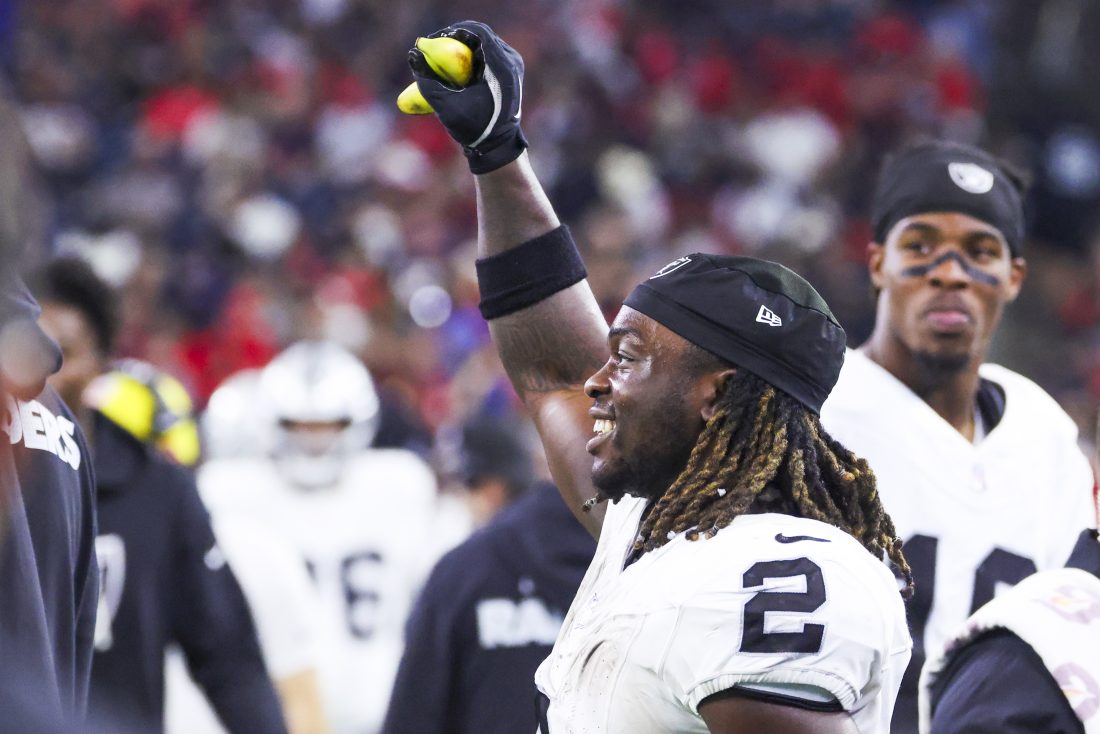 Dec 21, 2025; Houston, Texas, USA; Las Vegas Raiders running back Ashton Jeanty (2) holds a banana on the sideline after catching a touchdown pass against the Houston Texans during the third quarter at NRG Stadium. Mandatory Credit: Troy Taormina-Imagn Images