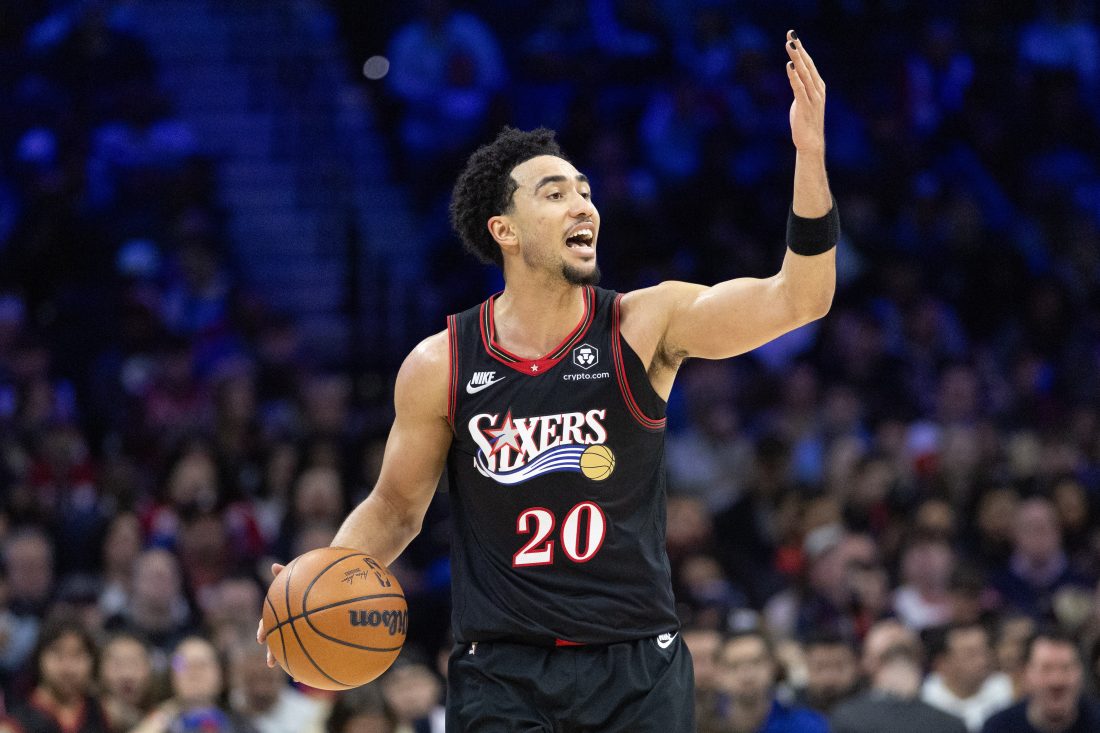 Dec 23, 2025; Philadelphia, Pennsylvania, USA; Philadelphia 76ers guard Jared McCain (20) controls the ball against the Brooklyn Nets during the third quarter at Xfinity Mobile Arena. Mandatory Credit: