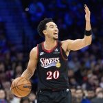Dec 23, 2025; Philadelphia, Pennsylvania, USA; Philadelphia 76ers guard Jared McCain (20) controls the ball against the Brooklyn Nets during the third quarter at Xfinity Mobile Arena. Mandatory Credit: