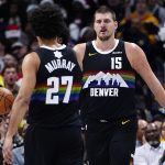 Dec 25, 2025; Denver, Colorado, USA; Denver Nuggets center Nikola Jokic (15) reacts against the Minnesota Timberwolves during the first half at Ball Arena. Mandatory Credit: Ron Chenoy-Imagn Images