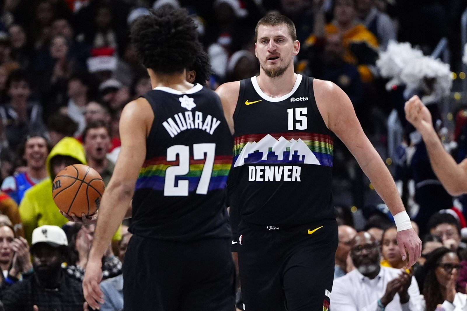 Dec 25, 2025; Denver, Colorado, USA; Denver Nuggets center Nikola Jokic (15) reacts against the Minnesota Timberwolves during the first half at Ball Arena. Mandatory Credit: Ron Chenoy-Imagn Images