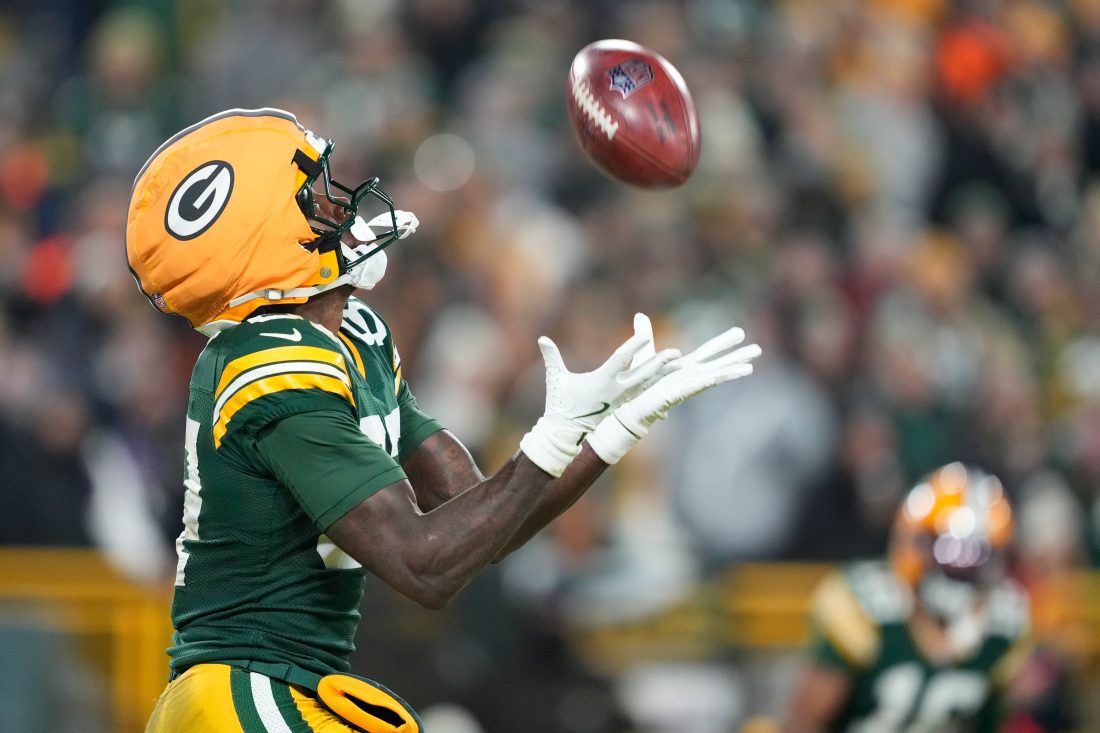 Dec 27, 2025; Green Bay, Wisconsin, USA; Green Bay Packers wide receiver Romeo Doubs (87) catches a punt during the third quarter against the Baltimore Ravens at Lambeau Field.
