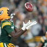 Dec 27, 2025; Green Bay, Wisconsin, USA; Green Bay Packers wide receiver Romeo Doubs (87) catches a punt during the third quarter against the Baltimore Ravens at Lambeau Field.