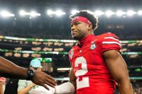 Ohio State Buckeyes defensive back Caleb Downs (2) leaves the field following the Cotton Bowl at AT&T Stadium in Arlington, Texas for the College Football Playoff quarterfinal game against the Miami Hurricanes on Dec. 31, 2025. Ohio State lost 24-14.