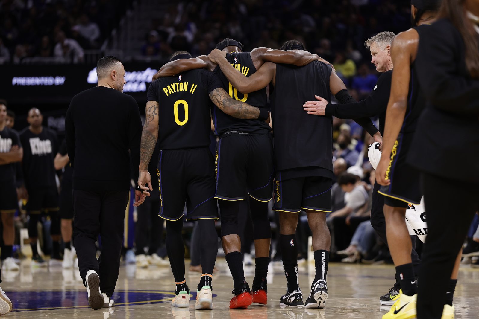 Jan 19, 2026; San Francisco, California, USA; Golden State Warriors forward Jimmy Butler III (10) is helped off the court after a knee injury during the third quarter against the Miami Heat at Chase Center. Mandatory Credit: Kelley L Cox-Imagn Images
