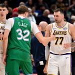 Jan 24, 2026; Dallas, Texas, USA; Dallas Mavericks forward Cooper Flagg (32) and Los Angeles Lakers guard Luka Doncic (77) exchange words after the game at the American Airlines Center. Mandatory Credit: Jerome Miron-Imagn Images