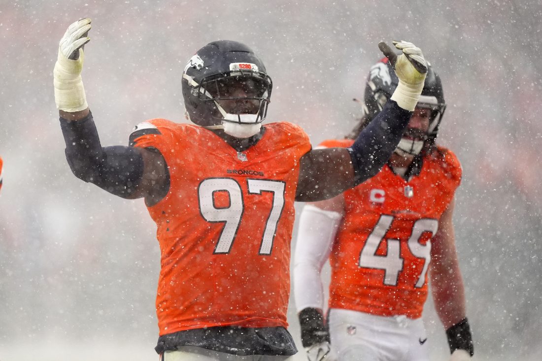 Jan 25, 2026; Denver, CO, USA; Denver Broncos defensive tackle Malcolm Roach (97) reacts against the New England Patriots during the second half in the 2026 AFC Championship Game at Empower Field at Mile High. Mandatory Credit: Ron Chenoy-Imagn Images