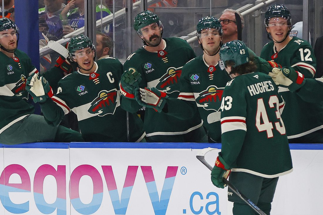 Jan 31, 2026; Edmonton, Alberta, CAN; The Minnesota Wild celebrate a goal scored by defensemen Quinn Hughes (43) during the second period against the Edmonton Oilers at Rogers Place. Mandatory Credit: Perry Nelson-Imagn Images