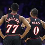 Jan 31, 2026; Philadelphia, Pennsylvania, USA; Philadelphia 76ers guard Tyrese Maxey (0) and guard Vj Edgecombe (77) look on against the New Orleans Pelicans during the second quarter at Xfinity Mobile Arena. Mandatory Credit: Bill Streicher-Imagn Images