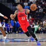 Feb 2, 2026; Inglewood, California, USA; Los Angeles Clippers guard Jordan Miller (22) moves the ball against Philadelphia 76ers guard Tyrese Maxey (0) during the first half at Intuit Dome. Mandatory Credit: Gary A. Vasquez-Imagn Images
