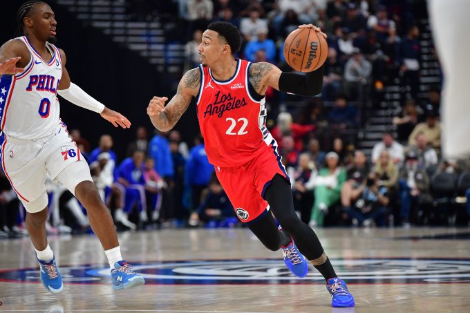 Feb 2, 2026; Inglewood, California, USA; Los Angeles Clippers guard Jordan Miller (22) moves the ball against Philadelphia 76ers guard Tyrese Maxey (0) during the first half at Intuit Dome. Mandatory Credit: Gary A. Vasquez-Imagn Images