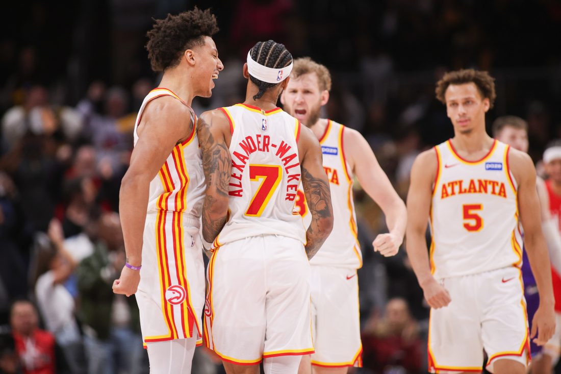 Feb 5, 2026; Atlanta, Georgia, USA; Atlanta Hawks guard Nickeil Alexander-Walker (7) celebrates with forward Jalen Johnson (1) and center Jock Landale (31) and guard Dyson Daniels (5) after a go-ahead basket against the Utah Jazz in the fourth quarter at State Farm Arena. Mandatory Credit: