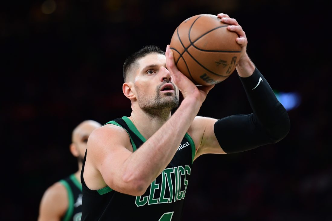 Feb 6, 2026; Boston, Massachusetts, USA; Boston Celtics center Nikola Vucevic (4) shoots a free throw during the second half against the Miami Heat at TD Garden.