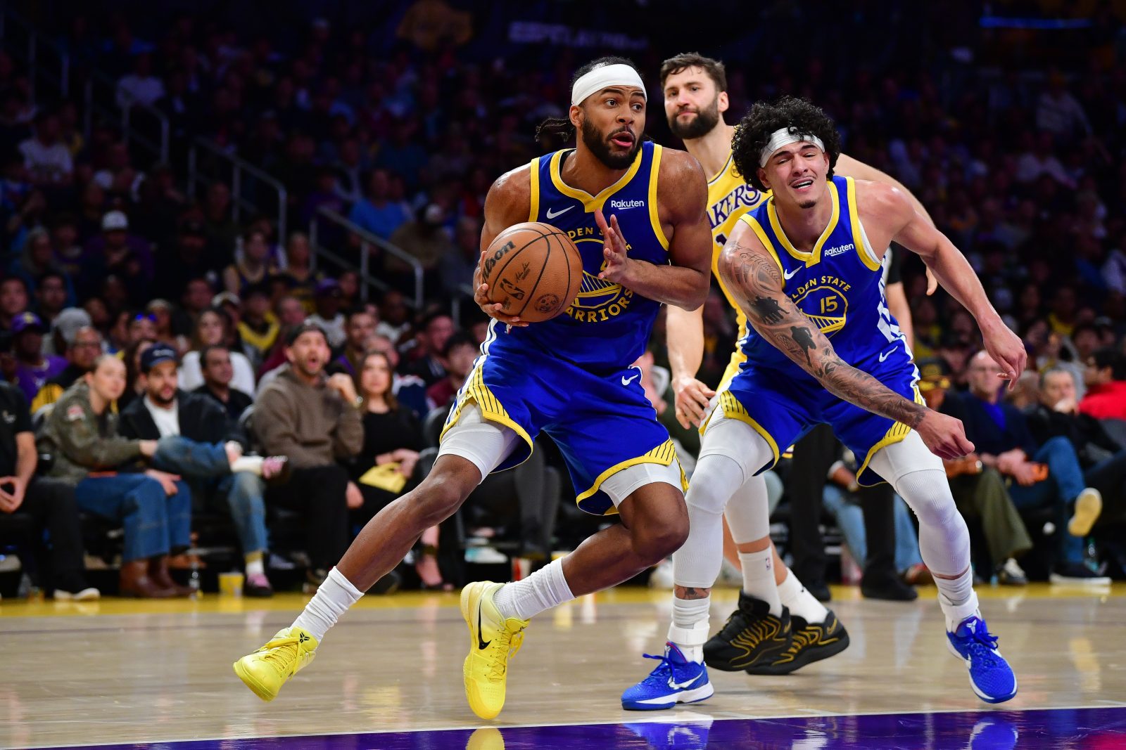 Feb 7, 2026; Los Angeles, California, USA; Golden State Warriors guard Moses Moody (4) moves to the basket against the Los Angeles Lakers during the second half at Crypto.com Arena. Mandatory Credit: Gary A. Vasquez-Imagn Images
