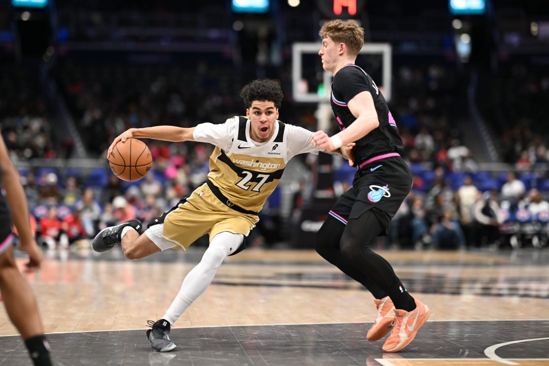 Feb 8, 2026; Washington, District of Columbia, USA; Washington Wizards guard Will Riley (27) attempts to dribble past Miami Heat guard Kasparas Jakucionis (25) Feb 8, 2026; Washington, District of Columbia, USA; during the fourth quarter at Capital One Arena. Mandatory Credit: