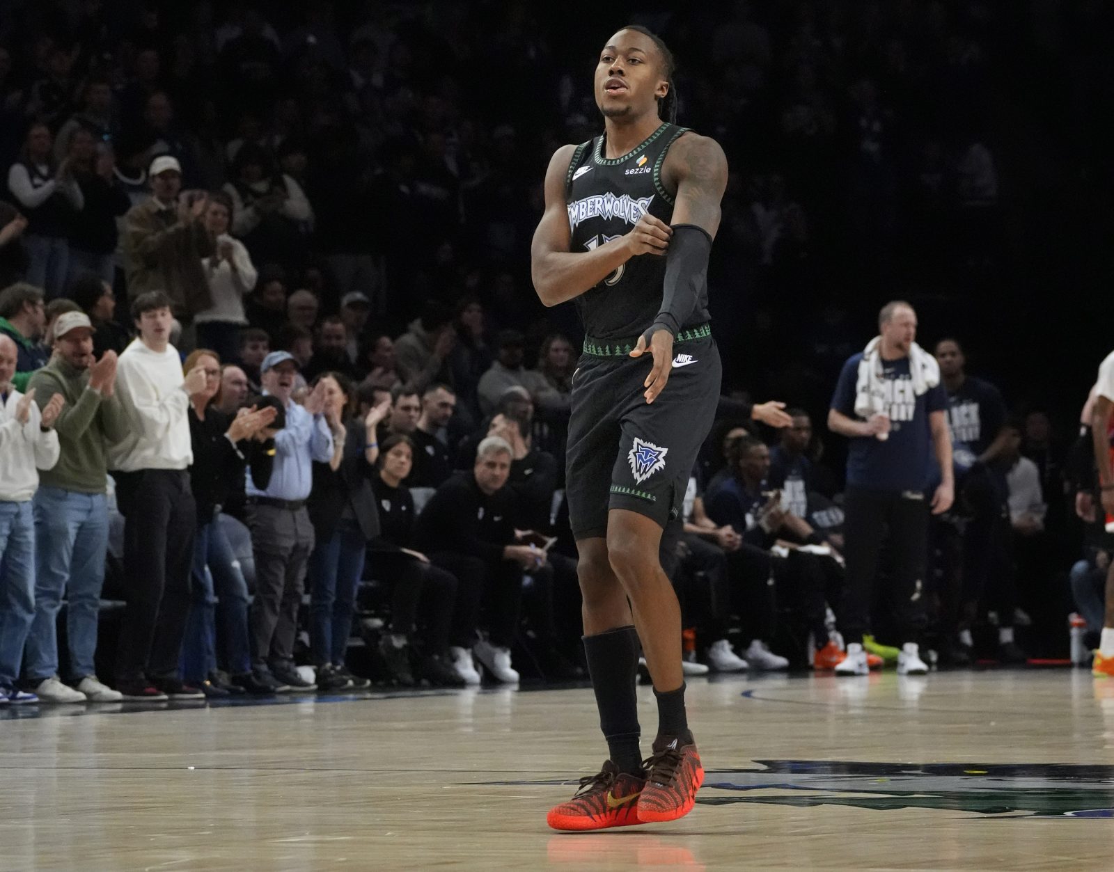 Feb 8, 2026; Minneapolis, Minnesota, USA; Minnesota Timberwolves guard Ayo Dosunmu (13) enters the game for the first time as a member of the team and receives a standing ovation as he readies to play the Los Angeles Clippers in the first quarter at Target Center. Mandatory Credit:
