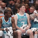Feb 9, 2026; Charlotte, North Carolina, USA; Charlotte Hornets forward Moussa Diabaté (14) and guard/forward Kon Knueppel (7) and guard LaMelo Ball (1) get a break during the second quarter against the Detroit Pistons at Spectrum Center. Mandatory Credit: Jim Dedmon-Imagn Images