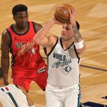 Feb 15, 2026; Inglewood, California, USA; Team World guard Luka Doncic (77) of the Los Angeles Lakers shoots against Team USA Stars guard Anthony Edwards (5) of the Minnesota Timberwolves in game one during the 75th NBA All Star Game at Intuit Dome. Mandatory Credit: Jayne Kamin-Oncea-Imagn Images