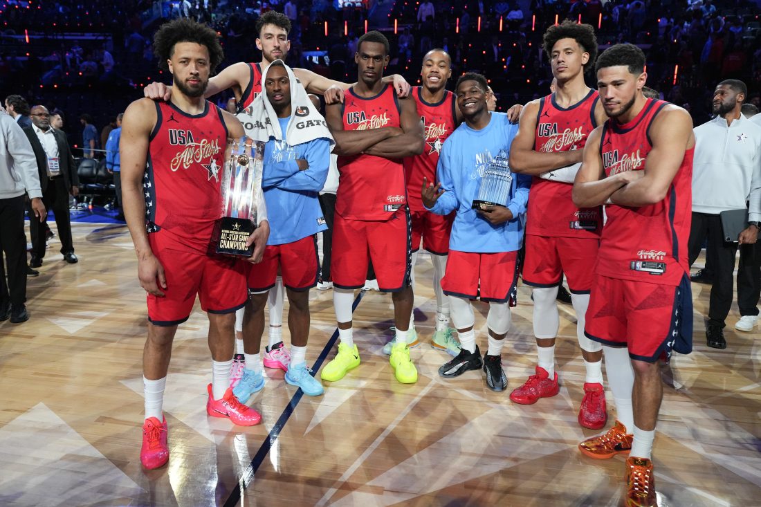 Feb 15, 2026; Inglewood, California, USA; Team USA Stars players, forward Scottie Barnes of the Toronto Raptors (4), guard Devin Booker of the Phoenix Suns (1), guard Cade Cunningham (2)and center Jalen Duren (0) of the Detroit Pistons, guard Anthony Edwards of the Minnesota Timberwolves, center Chet Holmgren of the Oklahoma City Thunder (7), forward Jalen Johnson of the Atlanta Hawks and guard Tyrese Maxey of the Philadelphia 76ers (0), pose for a photo after winning the All Star Championships against Team Stripes during the 75th NBA All Star Game at Intuit Dome. Mandatory Credit: Kirby Lee-Imagn Images
