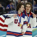 Feb 22, 2026; Milan, Italy; Quinn Hughes (43) of the United States and Jack Hughes (86) of the United States celebrate after defeating Canada in the men's ice hockey gold medal game during the Milano Cortina 2026 Olympic Winter Games at Milano Santagiulia Ice Hockey Arena. Mandatory Credit: Geoff Burke-Imagn Images