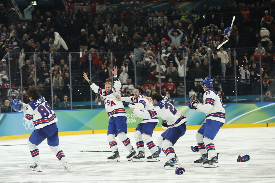 Feb 22, 2026; Milan, Italy; Jack Hughes #86 of Team United States celebrates with teammates after scoring the golden goal in overtime against Team Canada during the Milano Cortina 2026 Olympic Winter Games at Milano Santagiulia Ice Hockey Arena. Mandatory Credit: Geoff Burke-Imagn Images