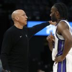 Feb 23, 2026; Memphis, Tennessee, USA; Sacramento Kings head coach Doug Christie talks with forward Precious Achiuwa (9) during the first quarter against the Memphis Grizzlies at FedExForum. Mandatory Credit: