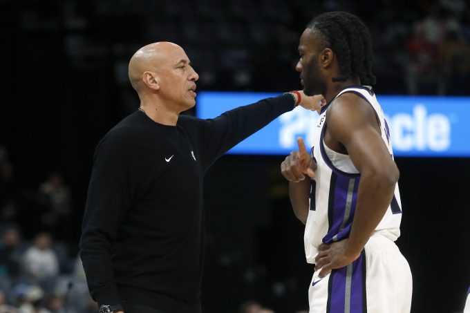 Feb 23, 2026; Memphis, Tennessee, USA; Sacramento Kings head coach Doug Christie talks with forward Precious Achiuwa (9) during the first quarter against the Memphis Grizzlies at FedExForum. Mandatory Credit: