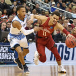 Mar 15, 2018; Pittsburgh, PA, USA; Oklahoma Sooners guard Trae Young (11) dribbles against Rhode Island Rams guard Fatts Russell (2) during the first half in the first round of the 2018 NCAA Tournament at PPG Paints Arena. Rhode Island won 83-78 in overtime. Mandatory Credit: Charles LeClaire-USA TODAY Sports