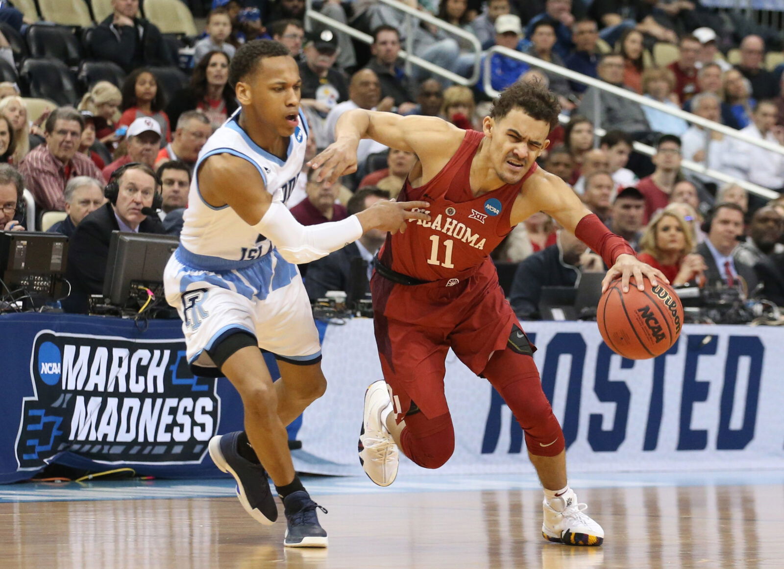 Mar 15, 2018; Pittsburgh, PA, USA; Oklahoma Sooners guard Trae Young (11) dribbles against Rhode Island Rams guard Fatts Russell (2) during the first half in the first round of the 2018 NCAA Tournament at PPG Paints Arena. Rhode Island won 83-78 in overtime. Mandatory Credit: Charles LeClaire-USA TODAY Sports