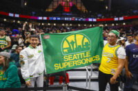 Oct 10, 2023; Seattle, Washington, USA; Fans hold a flag for the Seattle Supersonics during the fourth quarter of a game between the Utah Jazz and LA Clippers at Climate Pledge Arena. Mandatory Credit: Joe Nicholson-USA TODAY Sports