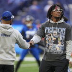 Oct 22, 2023; Indianapolis, Indiana, USA; Indianapolis Colts quarterback Anthony Richardson (5), who is out for the season due to injury, walks the field before the team faces the Cleveland Browns at Lucas Oil Stadium. Mandatory Credit: Jenna Watson-USA TODAY Sports