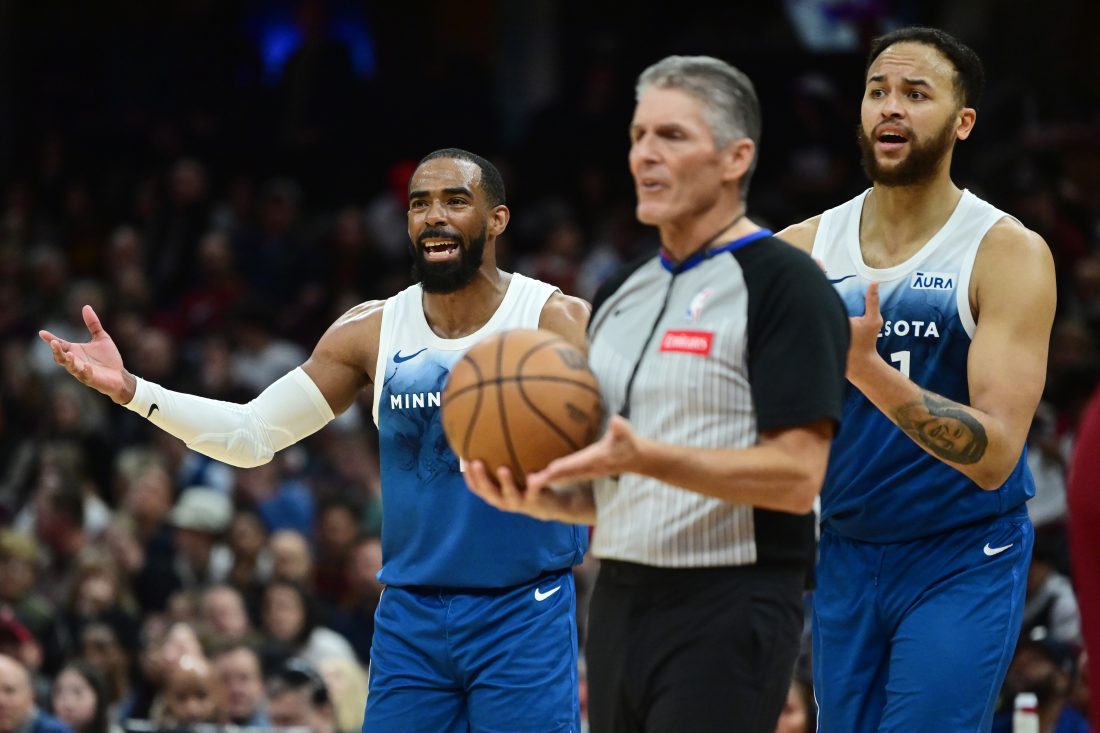 Mar 8, 2024; Cleveland, Ohio, USA; Minnesota Timberwolves guard Mike Conley (10) and forward Kyle Anderson (1) react after a foul call during the second half against the Cleveland Cavaliers at Rocket Mortgage FieldHouse. Mandatory Credit: Ken Blaze-USA TODAY Sports