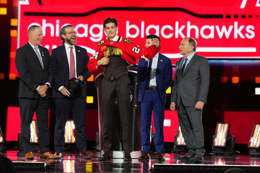 Jun 28, 2024; Las Vegas, Nevada, USA; Sacha Boisvert is selected by the Chicago Blackhawks with the 18th overall pick in the first round of the 2024 NHL Draft at The Sphere. Mandatory Credit: Stephen R. Sylvanie-USA TODAY Sports