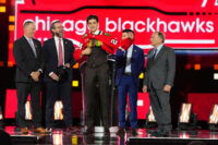 Jun 28, 2024; Las Vegas, Nevada, USA; Sacha Boisvert is selected by the Chicago Blackhawks with the 18th overall pick in the first round of the 2024 NHL Draft at The Sphere. Mandatory Credit: Stephen R. Sylvanie-USA TODAY Sports