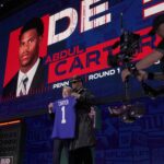 Penn State defensive end Abdul Carter poses with NFL Commissioner Roger Goodell after being selected 3rd overall by the New York Giants during the first round of the 2025 NFL Draft at Lambeau Field on April 24, 2025 in Green Bay, Wisconsin.