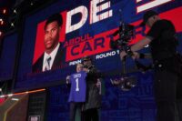 Penn State defensive end Abdul Carter poses with NFL Commissioner Roger Goodell after being selected 3rd overall by the New York Giants during the first round of the 2025 NFL Draft at Lambeau Field on April 24, 2025 in Green Bay, Wisconsin.