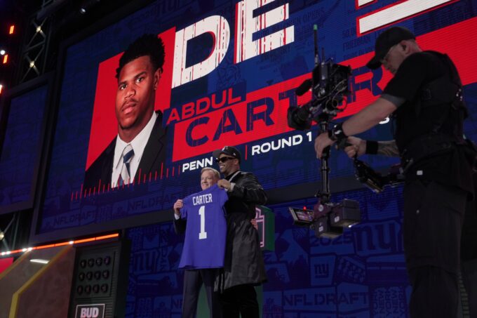 Penn State defensive end Abdul Carter poses with NFL Commissioner Roger Goodell after being selected 3rd overall by the New York Giants during the first round of the 2025 NFL Draft at Lambeau Field on April 24, 2025 in Green Bay, Wisconsin.