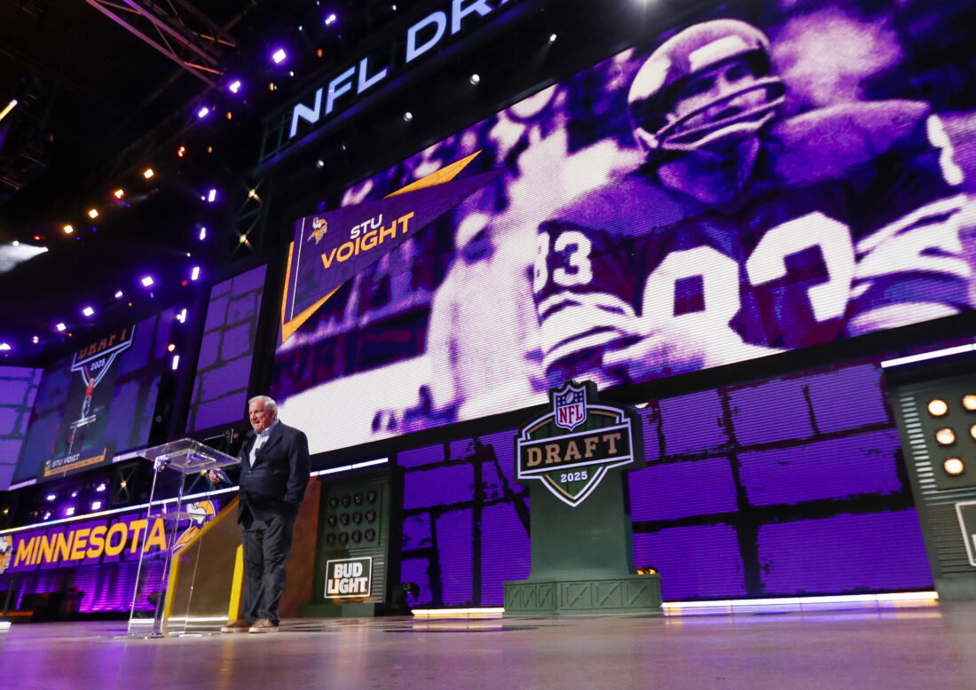 Apr 25, 2025; Green Bay, WI, USA; Former Minnesota Vikings tight end Stu Voigt announces the team’s selection with the 102nd overall pick during the third round of the 2025 NFL Draft at Lambeau Field. Mandatory Credit: Tork Mason/USA Today Network via Imagn Images