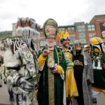 Green Bay Packers superfans gather for pictures with fans during the first day of the NFL Draft presented by Bud Light at the Draft Theater Thursday, April 24, 2025, outside of Lambeau Field in Green Bay, Wisconsin.